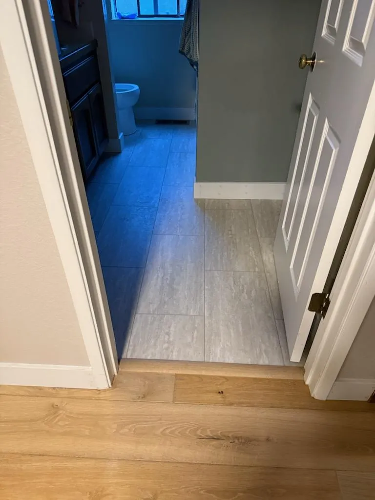 Hardwood-to-tile transition in a recently completed bathroom remodel